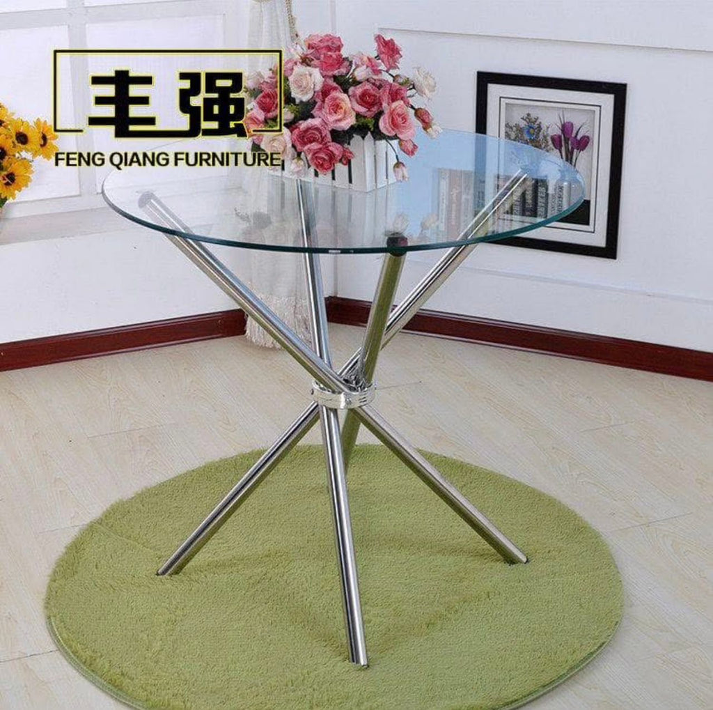 Prix : 18000f .                                 Table de salle à manger ronde de luxe moderne en métal et verre et très solide .